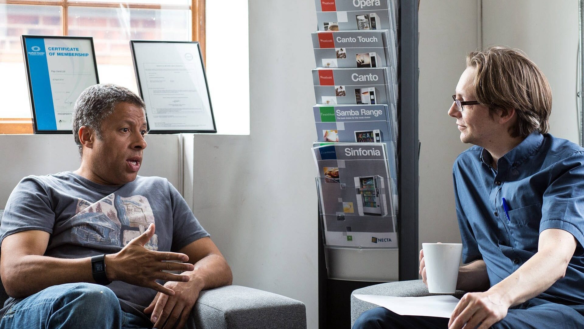 Two people sitting down having a meeting
