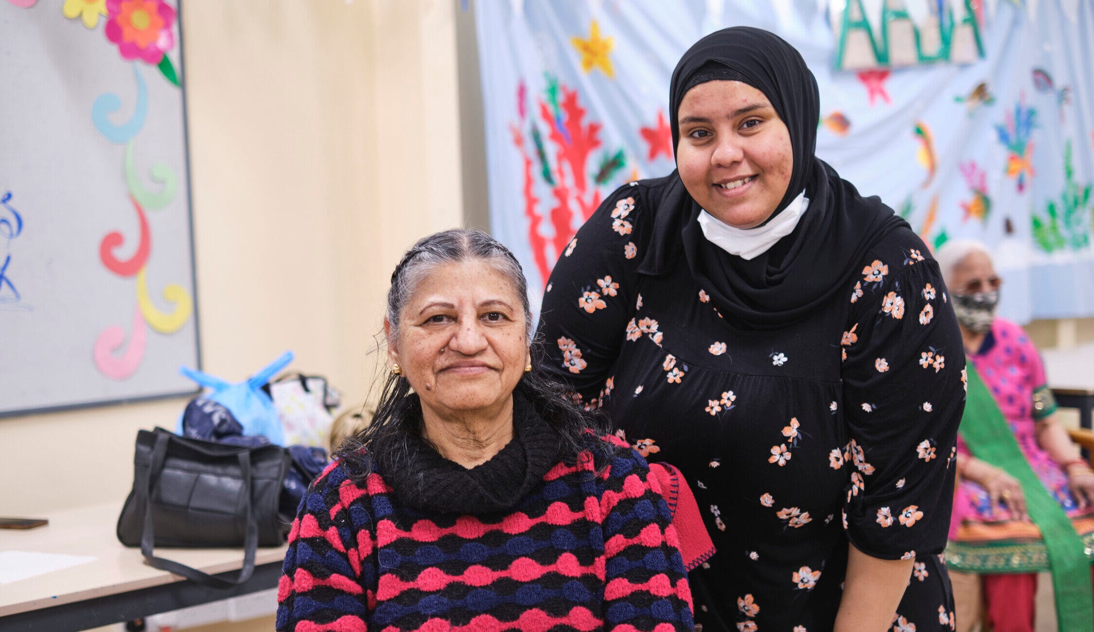 Two women smiling at the camera