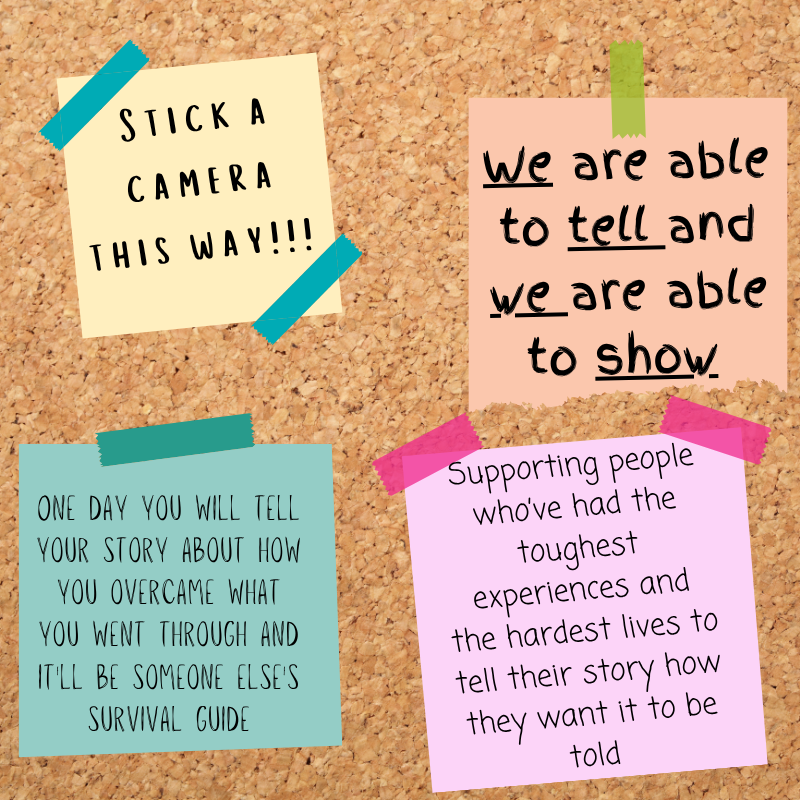 A corkboard-style graphic displays four colourful sticky notes containing reflections from a community reporting workshop. The notes read: &ldquo;Stick a camera this way!!!!&rdquo;, &ldquo;We are able to tell and we are able to show&rdquo;, &ldquo;One day you will tell your story about how you overcame what you went through and it'll be someone else's survival guide&rdquo;, and &ldquo;Supporting people who&rsquo;ve had the toughest experiences and the hardest lives to tell their story how they want it to be told.&rdquo; The notes are attached with coloured tape against a cork background, highlighting key themes of storytelling, lived experience and community voice.